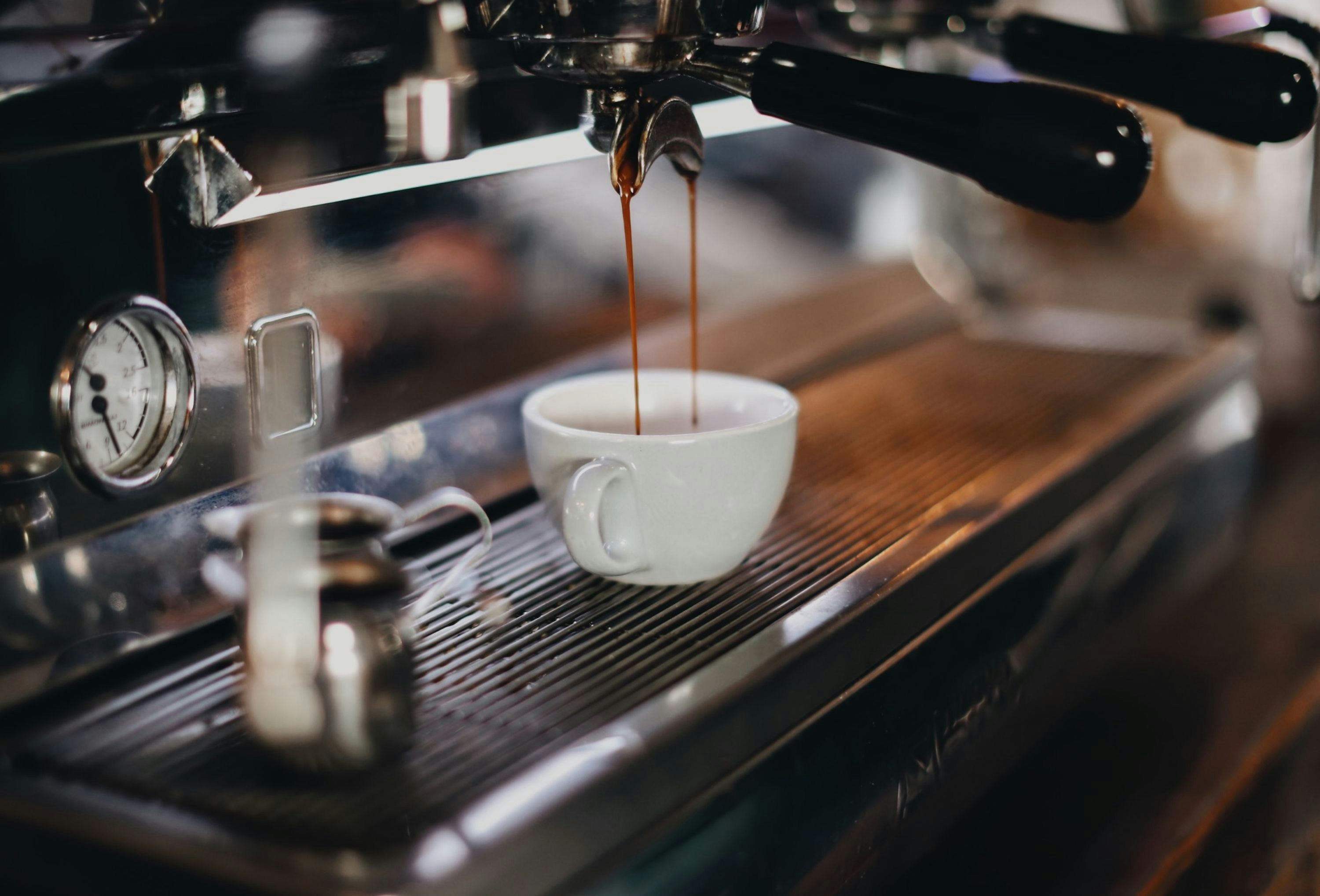 Espresso machine pulling a shot.